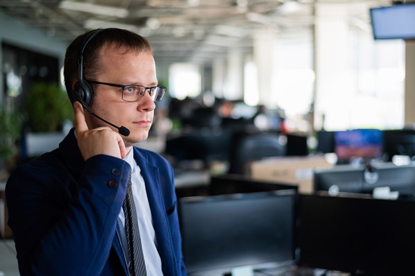 Call center manager monitoring a call