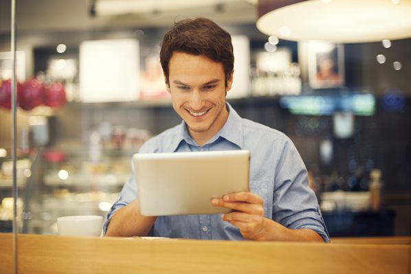 Restaurant manager using app on tablet