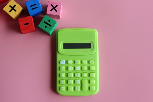Calculator and wooden mathematical cubes